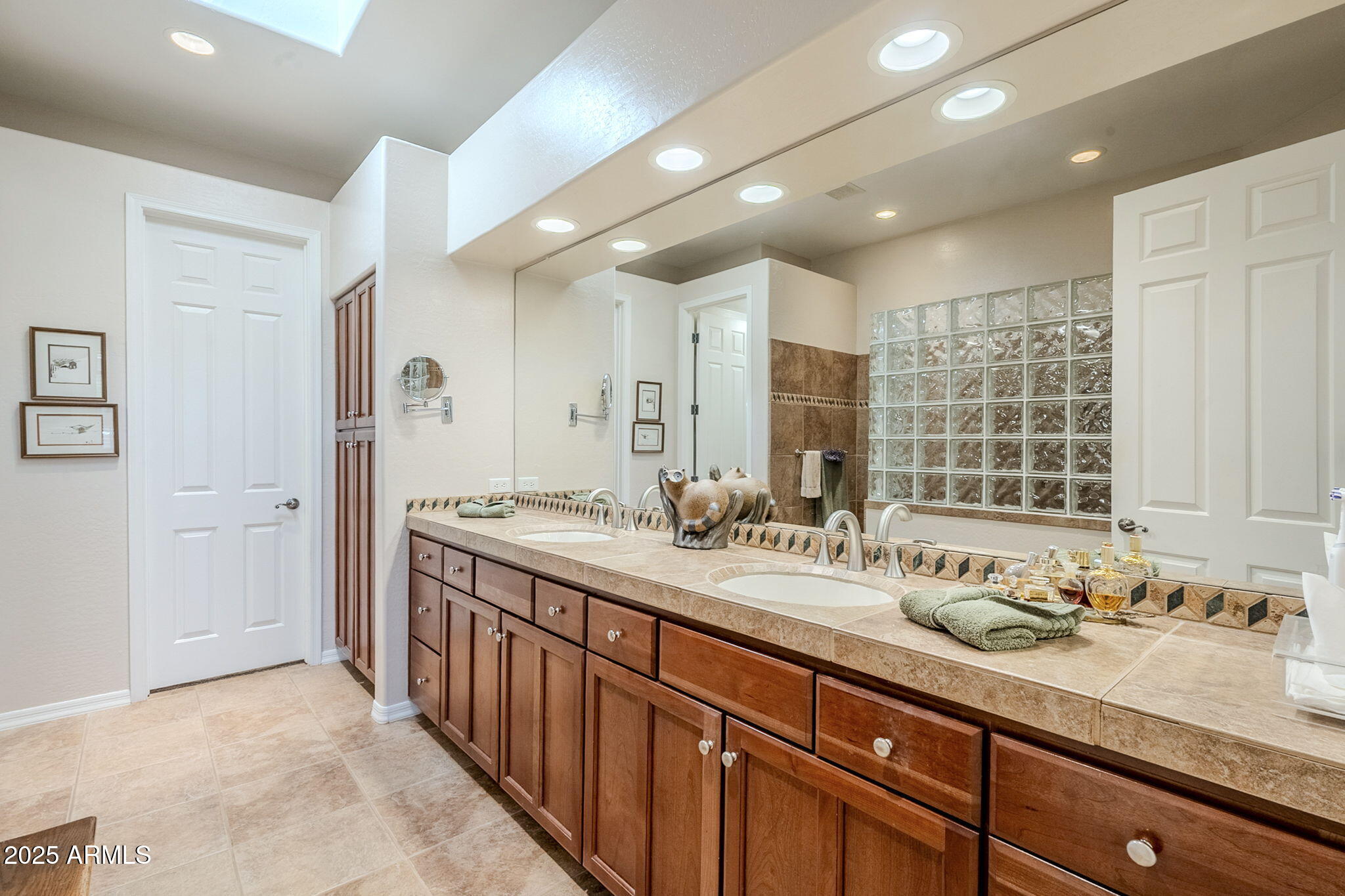 9270 East Thompson Peak Parkway, Unit 342 Scottsdale, AZ 85255 - Photo 24 of 40 a bathroom with a sink double vanity and a mirror