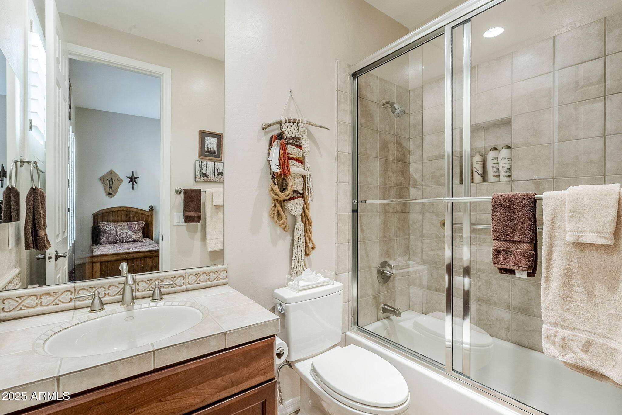 9270 East Thompson Peak Parkway, Unit 342 Scottsdale, AZ 85255 - Photo 32 of 40 a bathroom with a sink toilet and shower