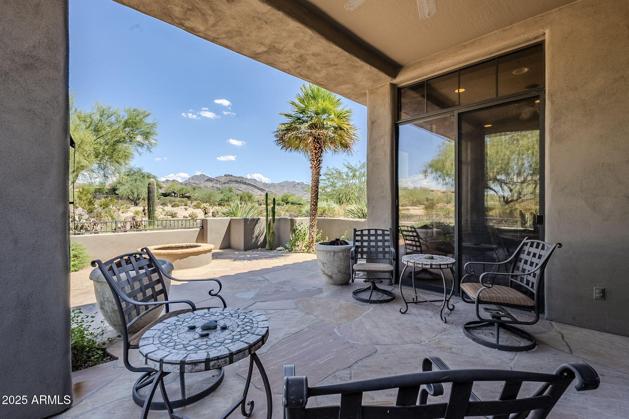 9270 East Thompson Peak Parkway, Unit 342 Scottsdale, AZ 85255 - Photo 35 of 40 a living room with furniture and a large window