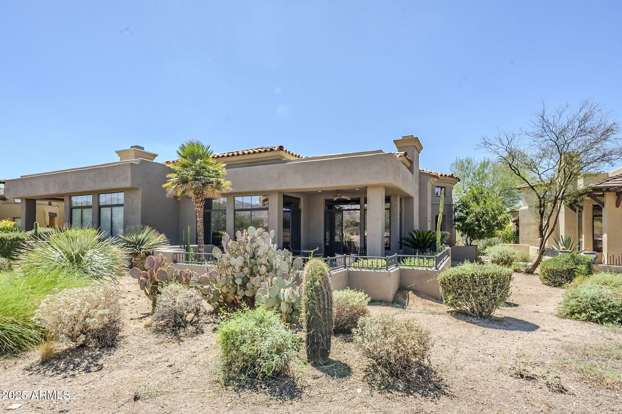 9270 East Thompson Peak Parkway, Unit 342 Scottsdale, AZ 85255 - Photo 38 of 40 a front view of a house with garden