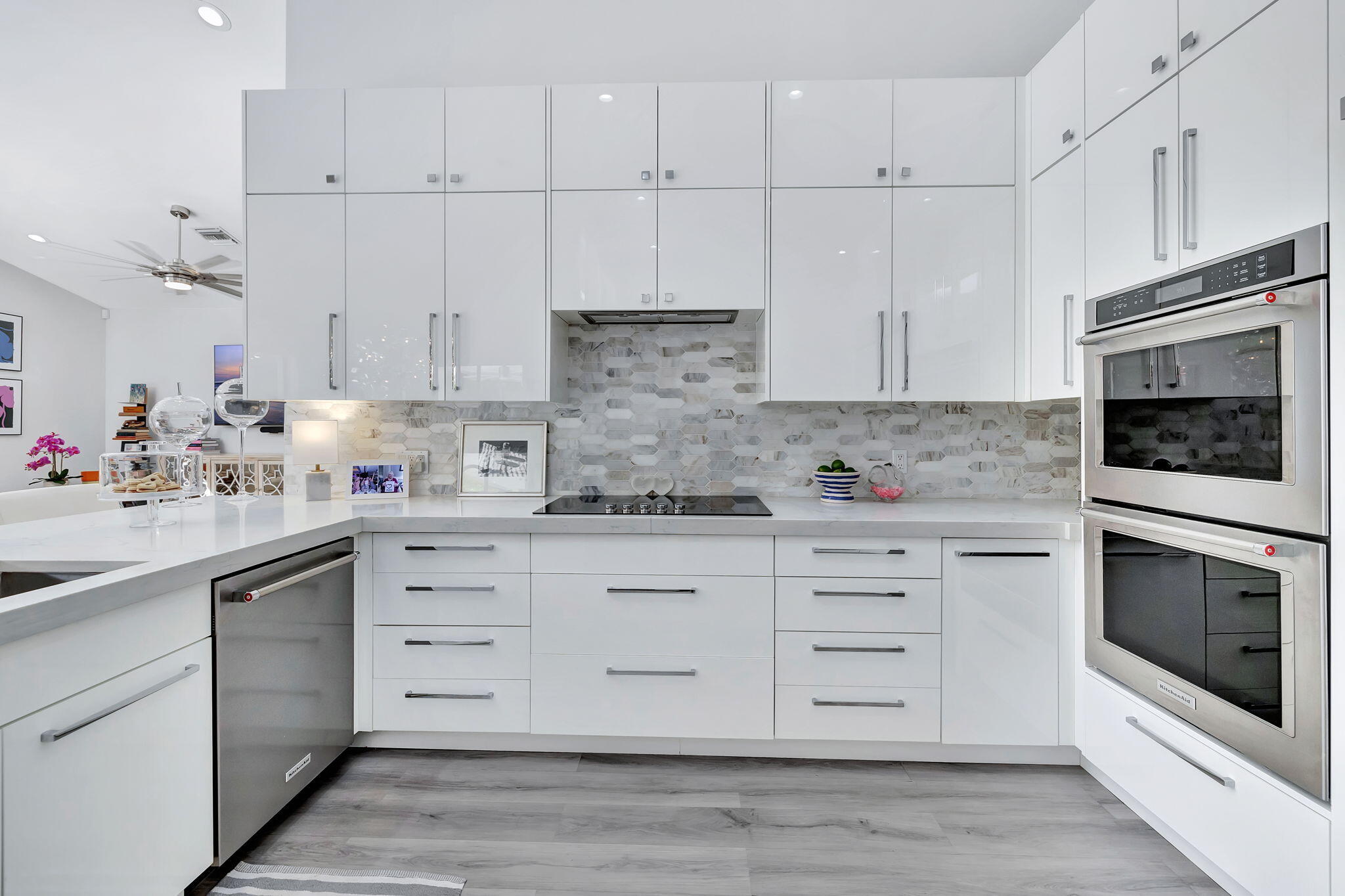 2298 Northwest 57th Street Boca Raton, FL 33496 - Photo 14 of 111 a kitchen with granite countertop white cabinets white stainless steel appliances and sink