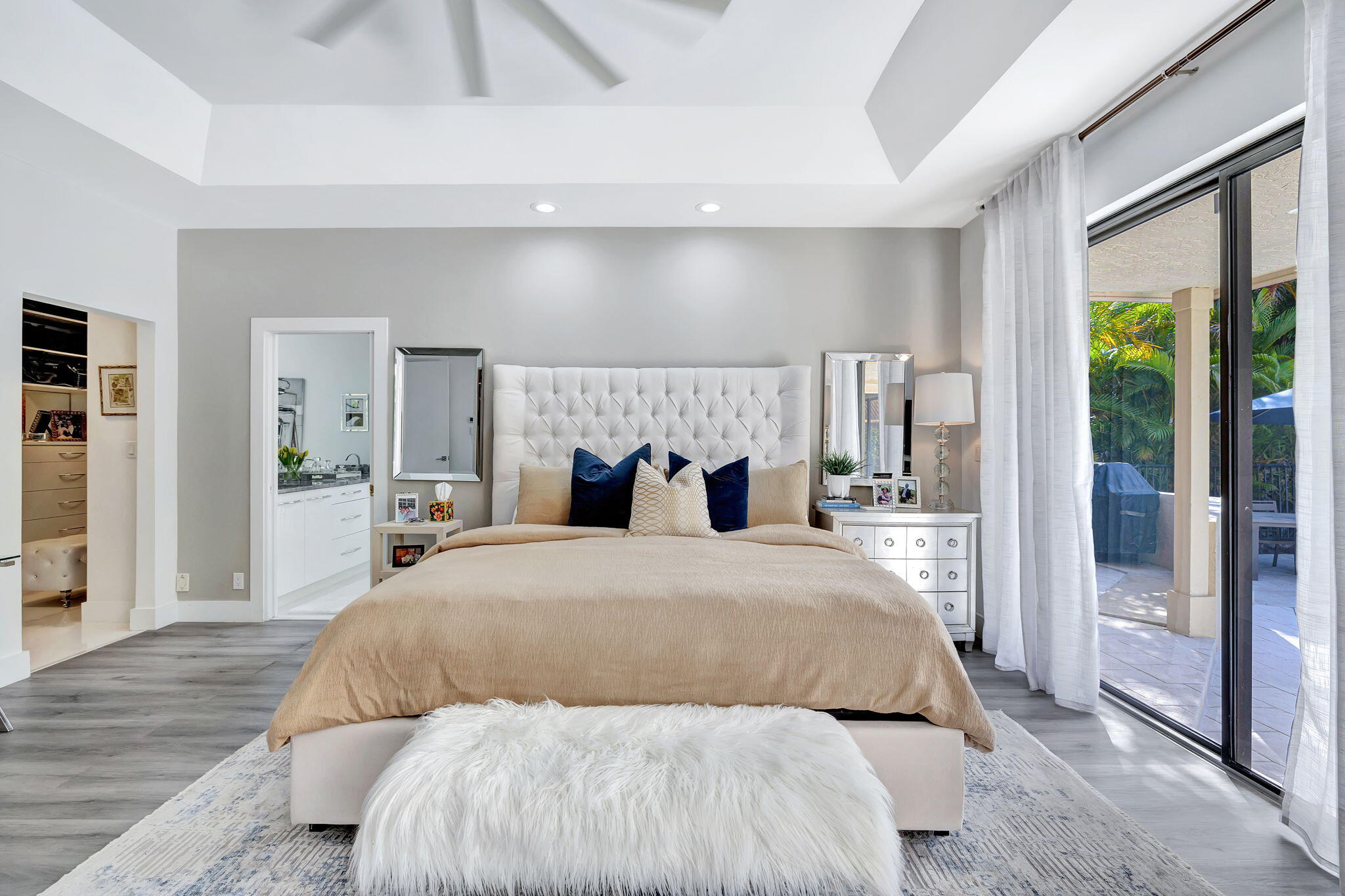 2298 Northwest 57th Street Boca Raton, FL 33496 - Photo 24 of 111 a bedroom with a large bed and a night stand