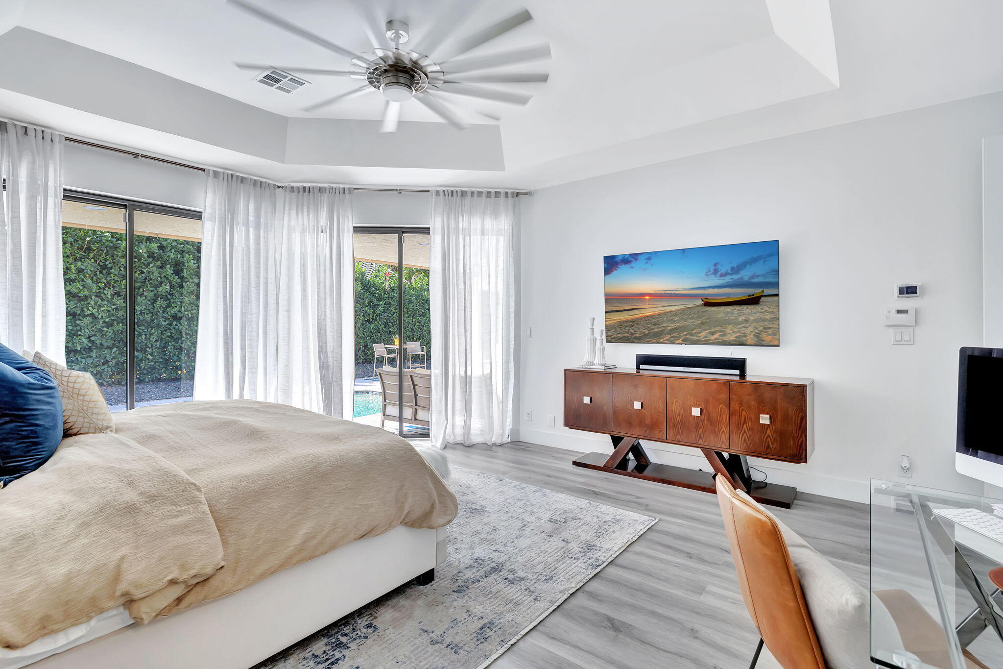 2298 Northwest 57th Street Boca Raton, FL 33496 - Photo 25 of 111 a bedroom with a bed and a flat screen tv