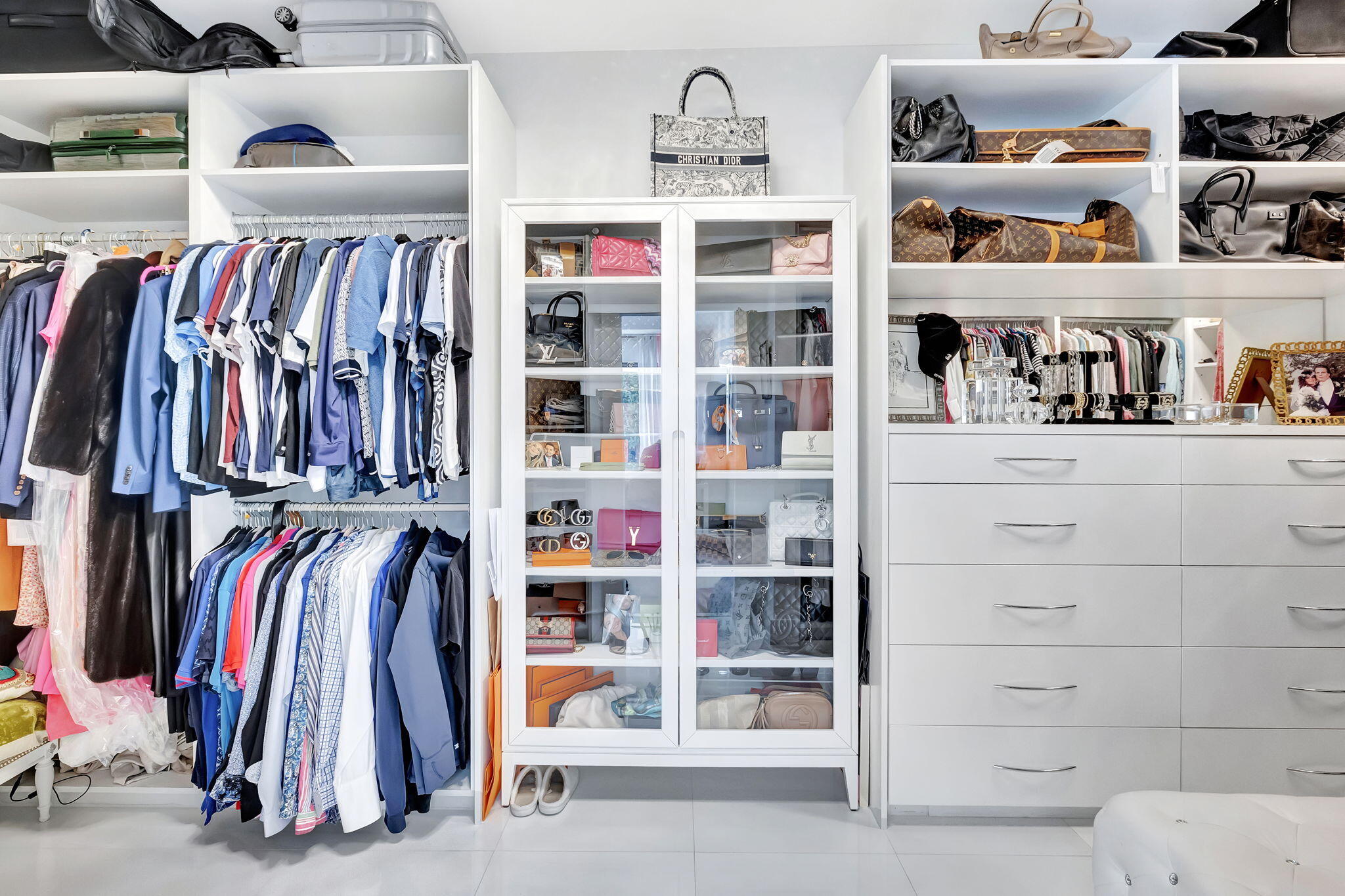 2298 Northwest 57th Street Boca Raton, FL 33496 - Photo 30 of 111 a view of walk in closet with clothes and shoes