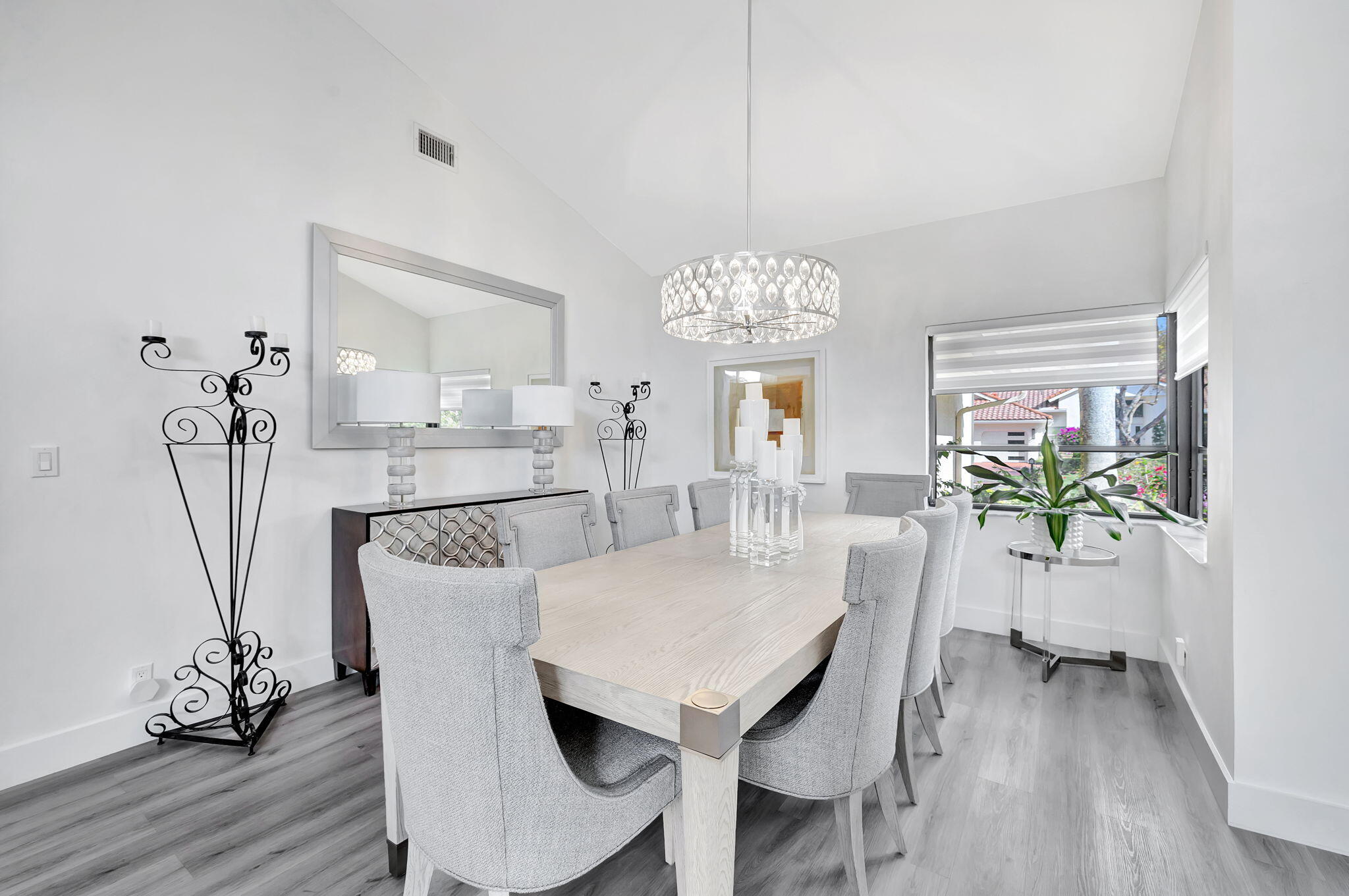 2298 Northwest 57th Street Boca Raton, FL 33496 - Photo 10 of 111 a view of a dining room with furniture and wooden floor