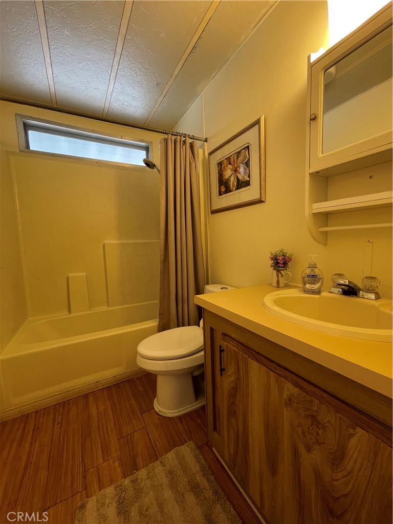 74711 Dillon Road, Unit 411 Desert Hot Springs, CA 92241 - Photo 13 of 26 a bathroom with a sink a toilet and bathtub