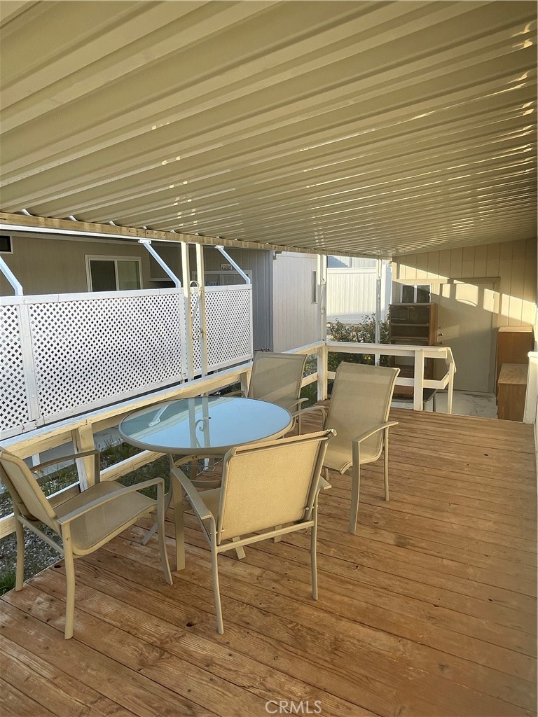 74711 Dillon Road, Unit 411 Desert Hot Springs, CA 92241 - Photo 14 of 26 a patio with table and chairs