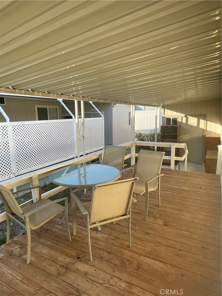 74711 Dillon Road, Unit 411 Desert Hot Springs, CA 92241 - Photo 16 of 26 a patio with table and chairs