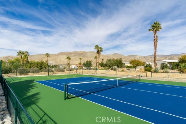 74711 Dillon Road, Unit 411 Desert Hot Springs, CA 92241 - Photo 23 of 26 a view of a tennis court