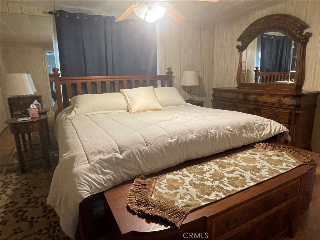 74711 Dillon Road, Unit 411 Desert Hot Springs, CA 92241 - Photo 7 of 26 a bedroom with a bed and dresser
