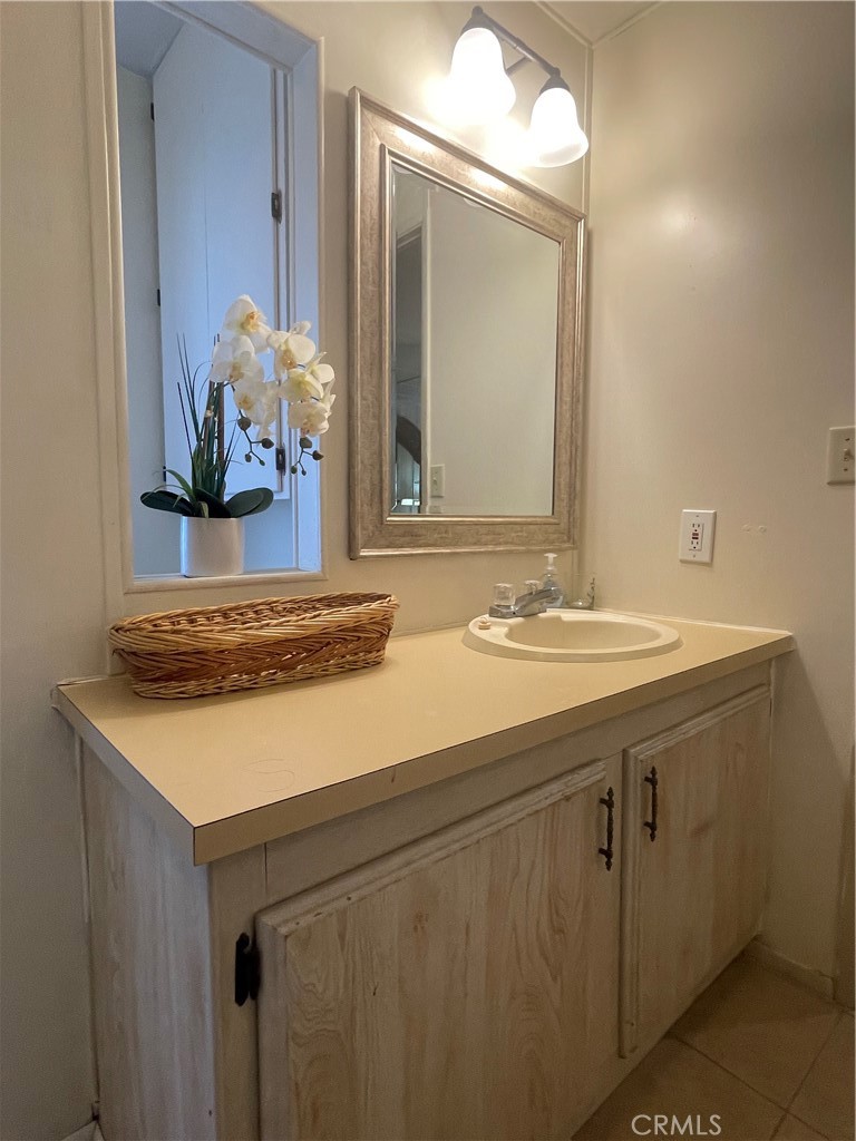 74711 Dillon Road, Unit 411 Desert Hot Springs, CA 92241 - Photo 8 of 26 a bathroom with a sink and a mirror