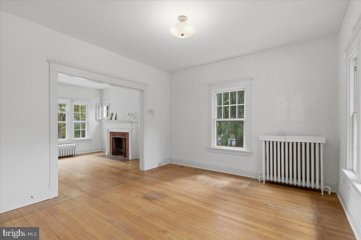5900 32nd Street Northwest Washington, DC 20015 - Photo 14 of 51 an empty room with fireplace and windows