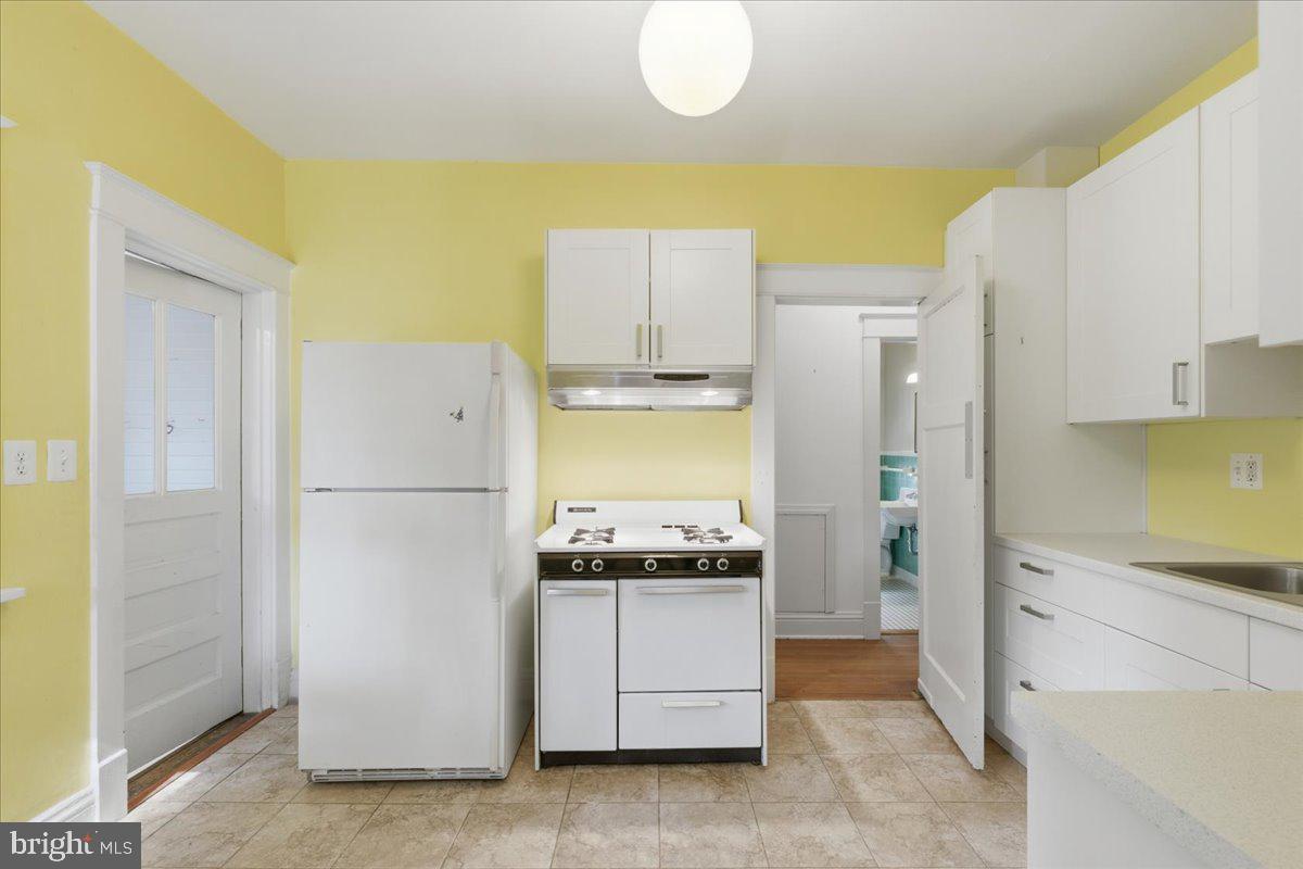 5900 32nd Street Northwest Washington, DC 20015 - Photo 15 of 51 a kitchen with a refrigerator and a stove