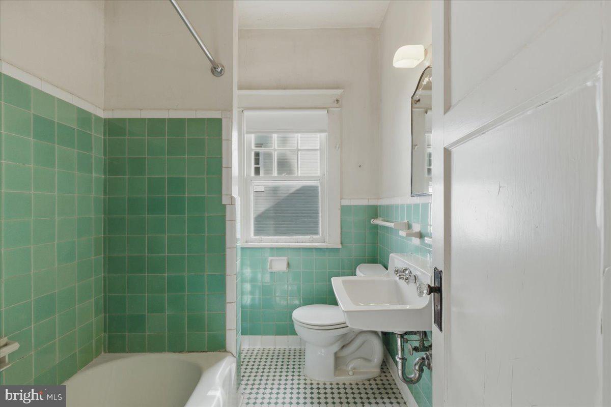 5900 32nd Street Northwest Washington, DC 20015 - Photo 20 of 51 a bathroom with a sink toilet and a mirror