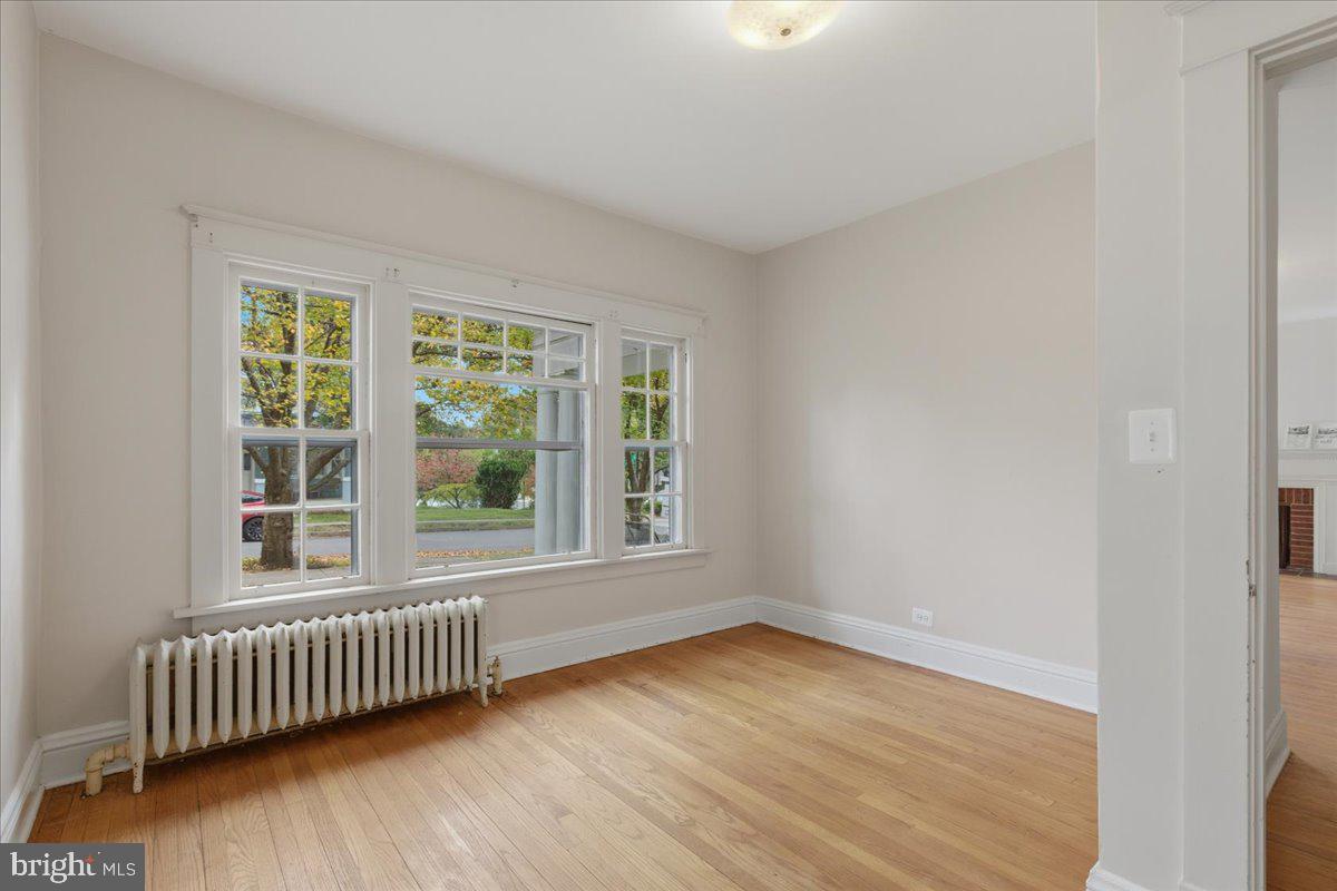 5900 32nd Street Northwest Washington, DC 20015 - Photo 22 of 51 an empty room with wooden floor and windows