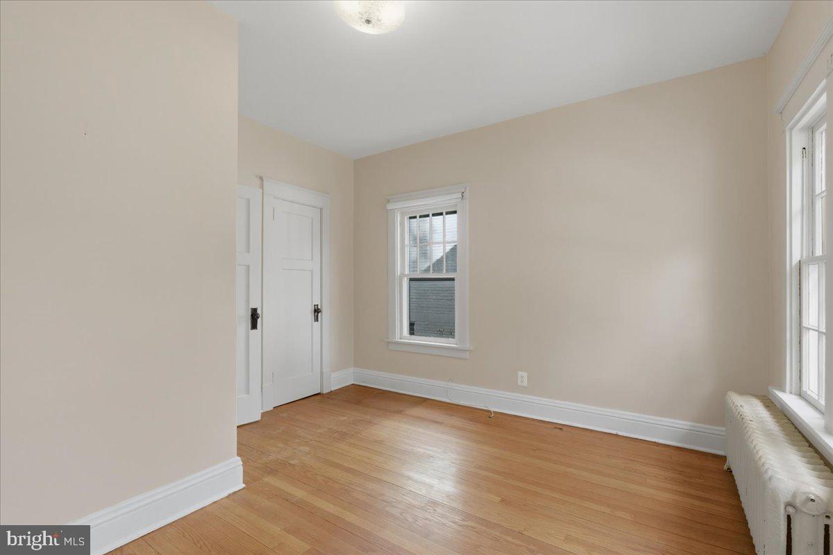 5900 32nd Street Northwest Washington, DC 20015 - Photo 24 of 51 an empty room with wooden floor and windows