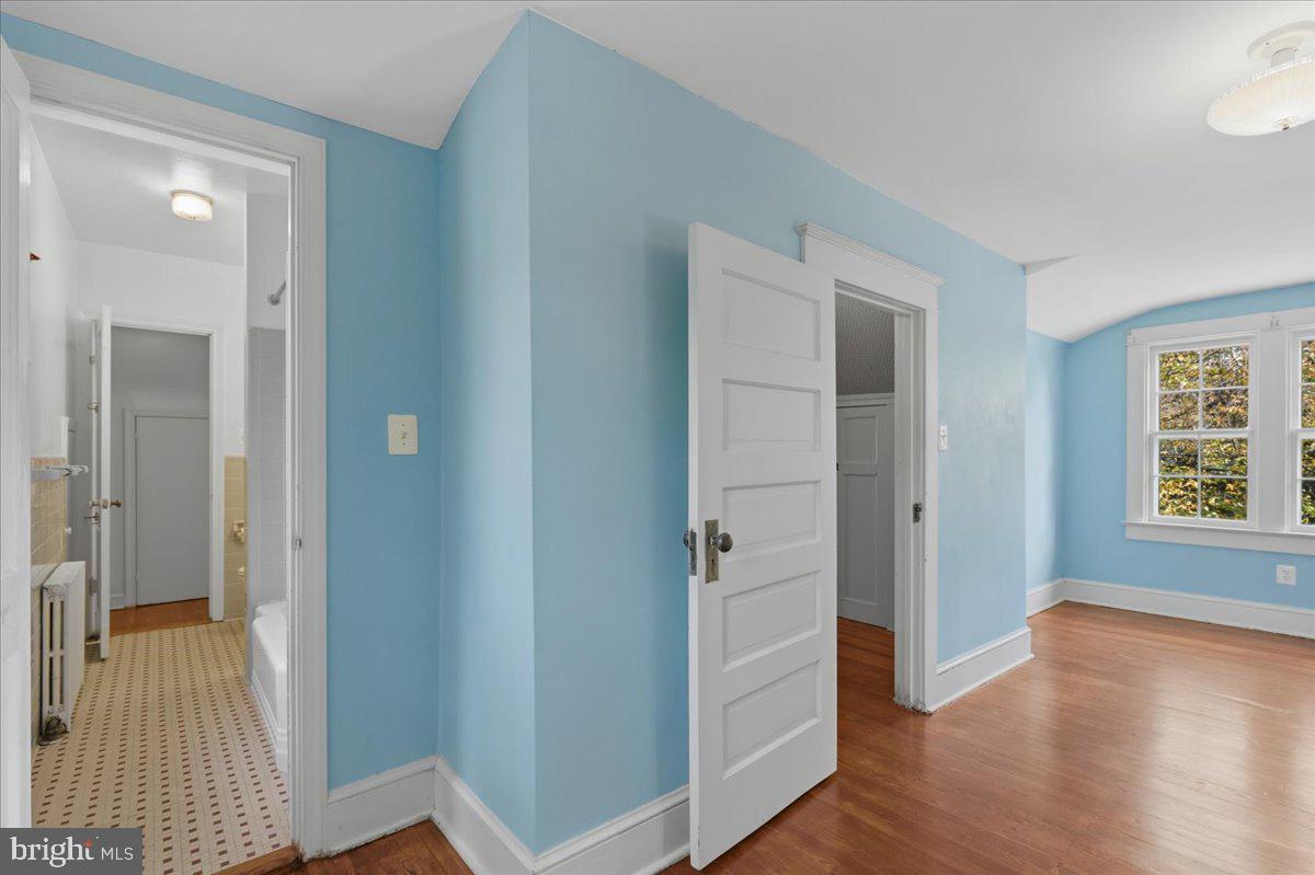 5900 32nd Street Northwest Washington, DC 20015 - Photo 29 of 51 a view of a hallway with bathroom and wooden floor