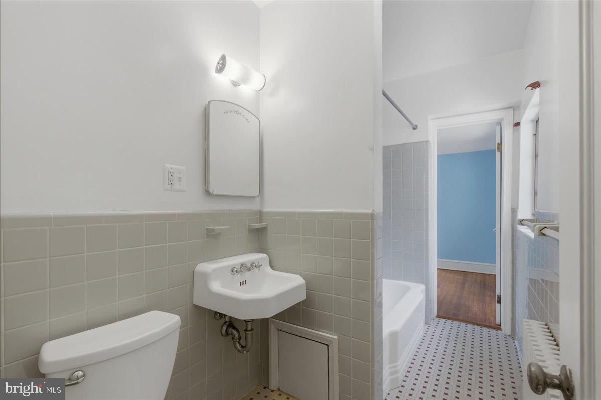 5900 32nd Street Northwest Washington, DC 20015 - Photo 31 of 51 a bathroom with a sink toilet and shower