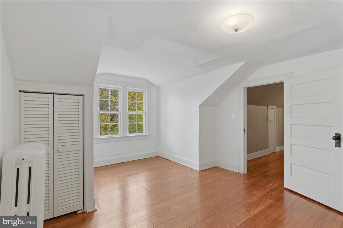 5900 32nd Street Northwest Washington, DC 20015 - Photo 32 of 51 an empty room with wooden floor and windows