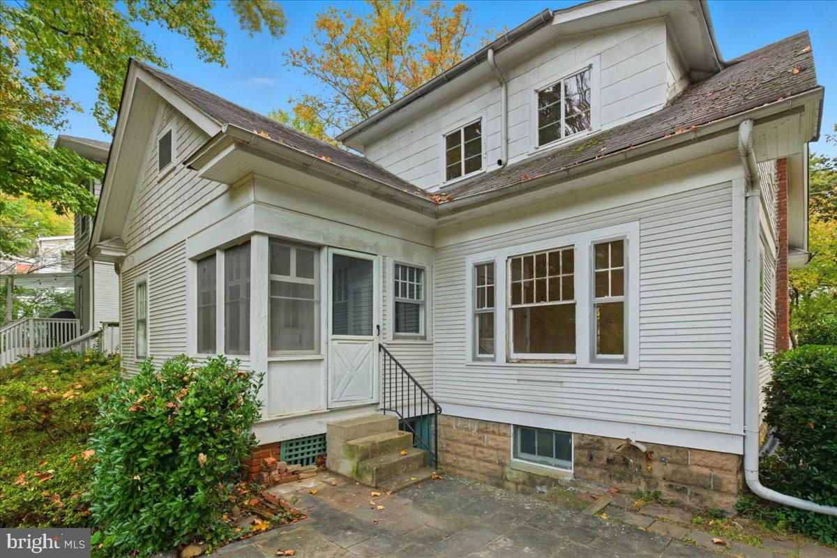 5900 32nd Street Northwest Washington, DC 20015 - Photo 42 of 51 a view of brick house with large windows and a table and chairs