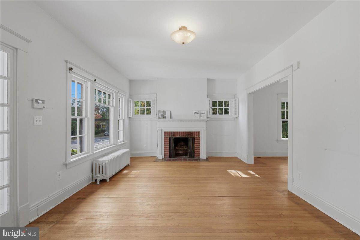 5900 32nd Street Northwest Washington, DC 20015 - Photo 7 of 51 a view of a livingroom with a fireplace and window