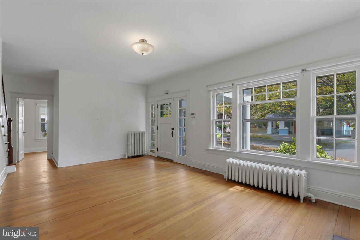 5900 32nd Street Northwest Washington, DC 20015 - Photo 10 of 51 wooden floor in an empty room with a window