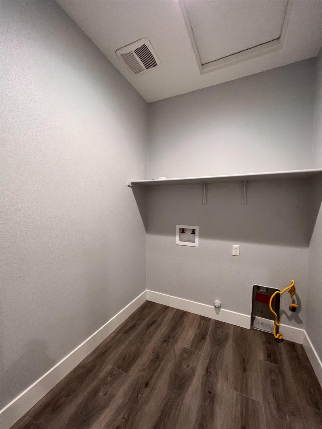 445 Expedition Avenue Madera, CA 93636 - Photo 21 of 36 a view of a room with wooden floor