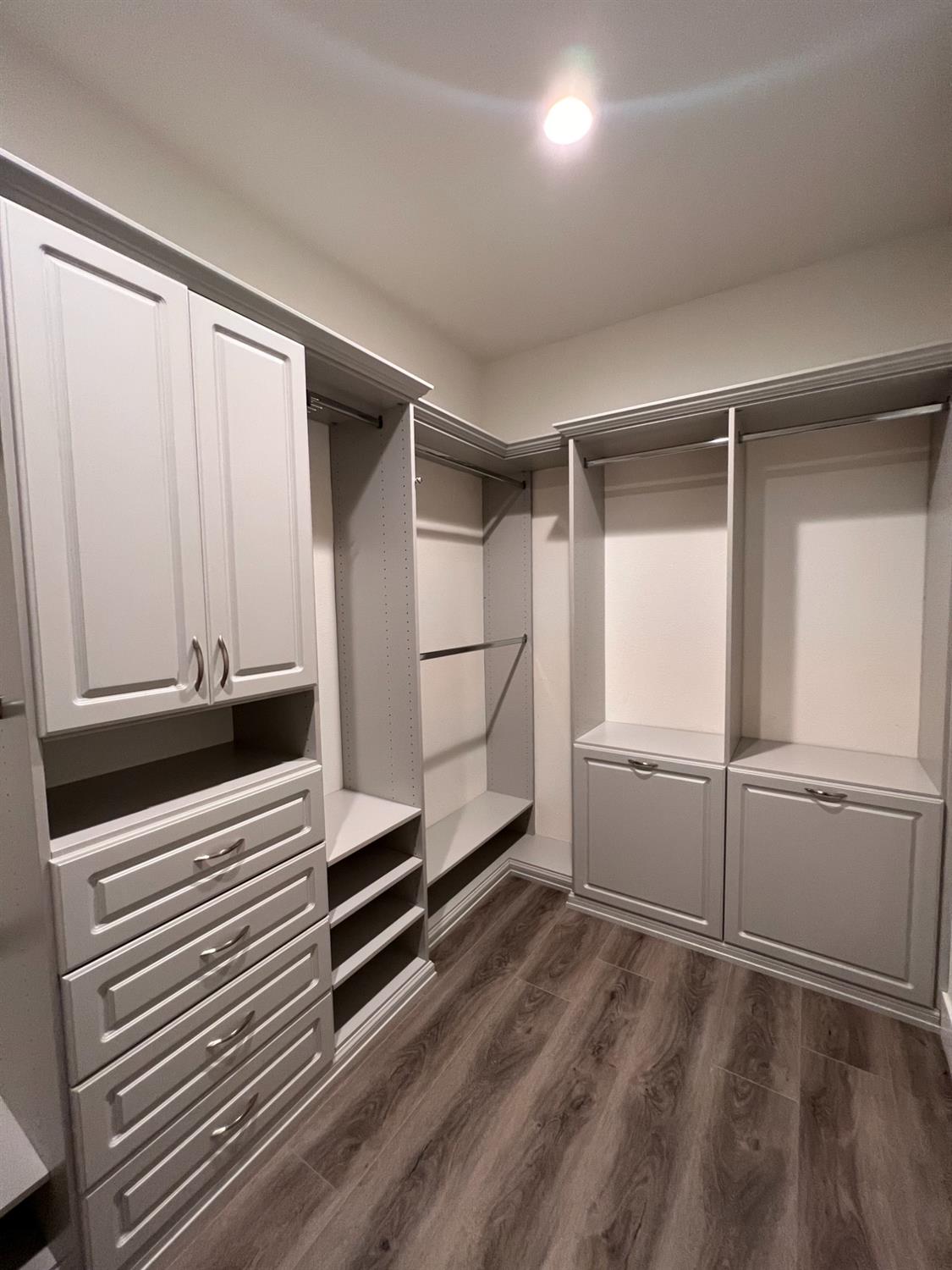 445 Expedition Avenue Madera, CA 93636 - Photo 31 of 36 a kitchen with white cabinets and white appliances