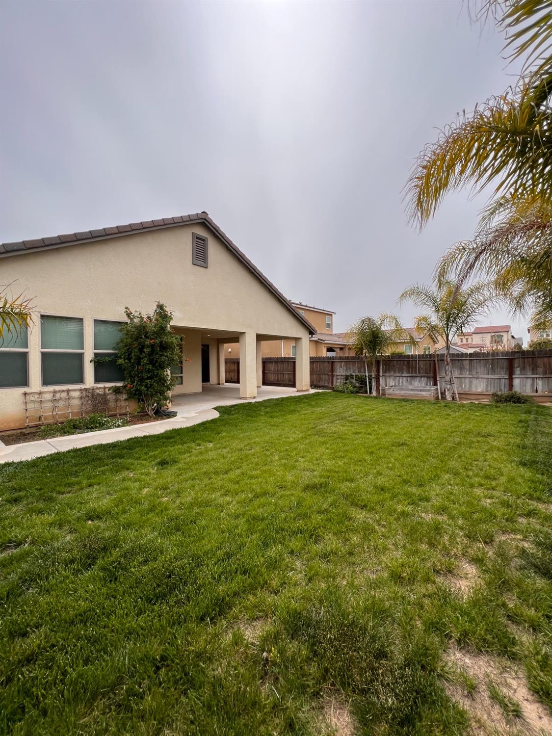 445 Expedition Avenue Madera, CA 93636 - Photo 36 of 36 a front view of house with yard and seating area