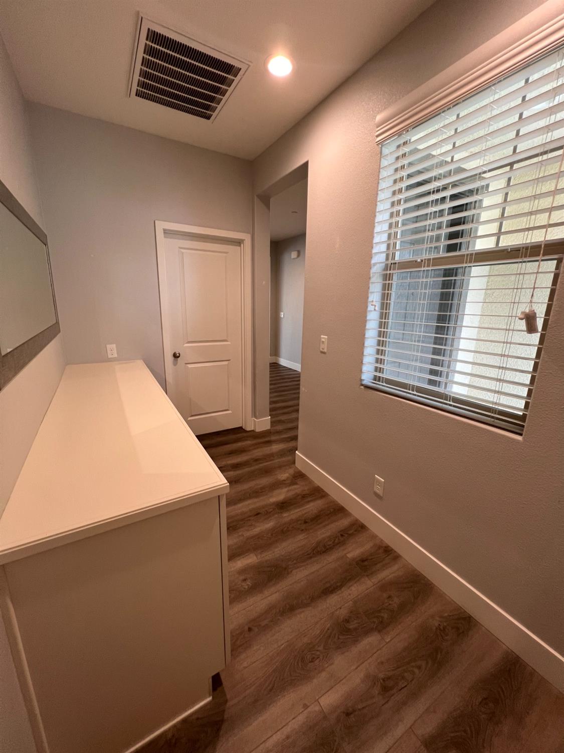 445 Expedition Avenue Madera, CA 93636 - Photo 6 of 36 a bedroom with a bed and a window