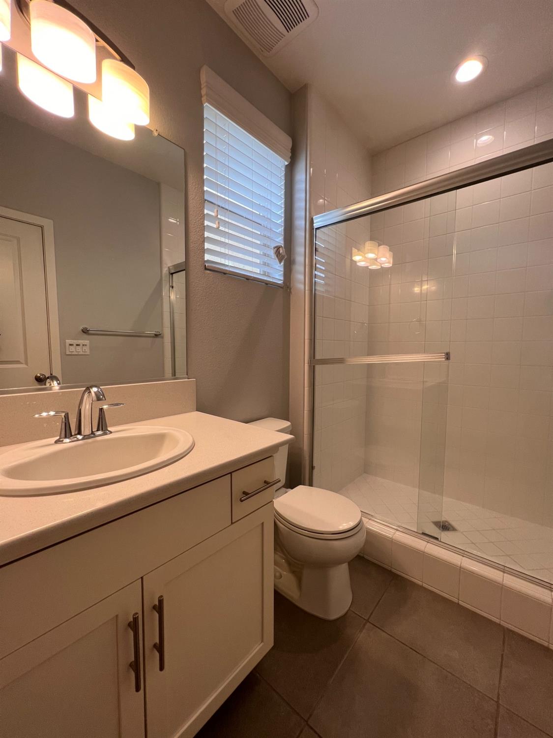 445 Expedition Avenue Madera, CA 93636 - Photo 9 of 36 a bathroom with a sink a toilet and shower