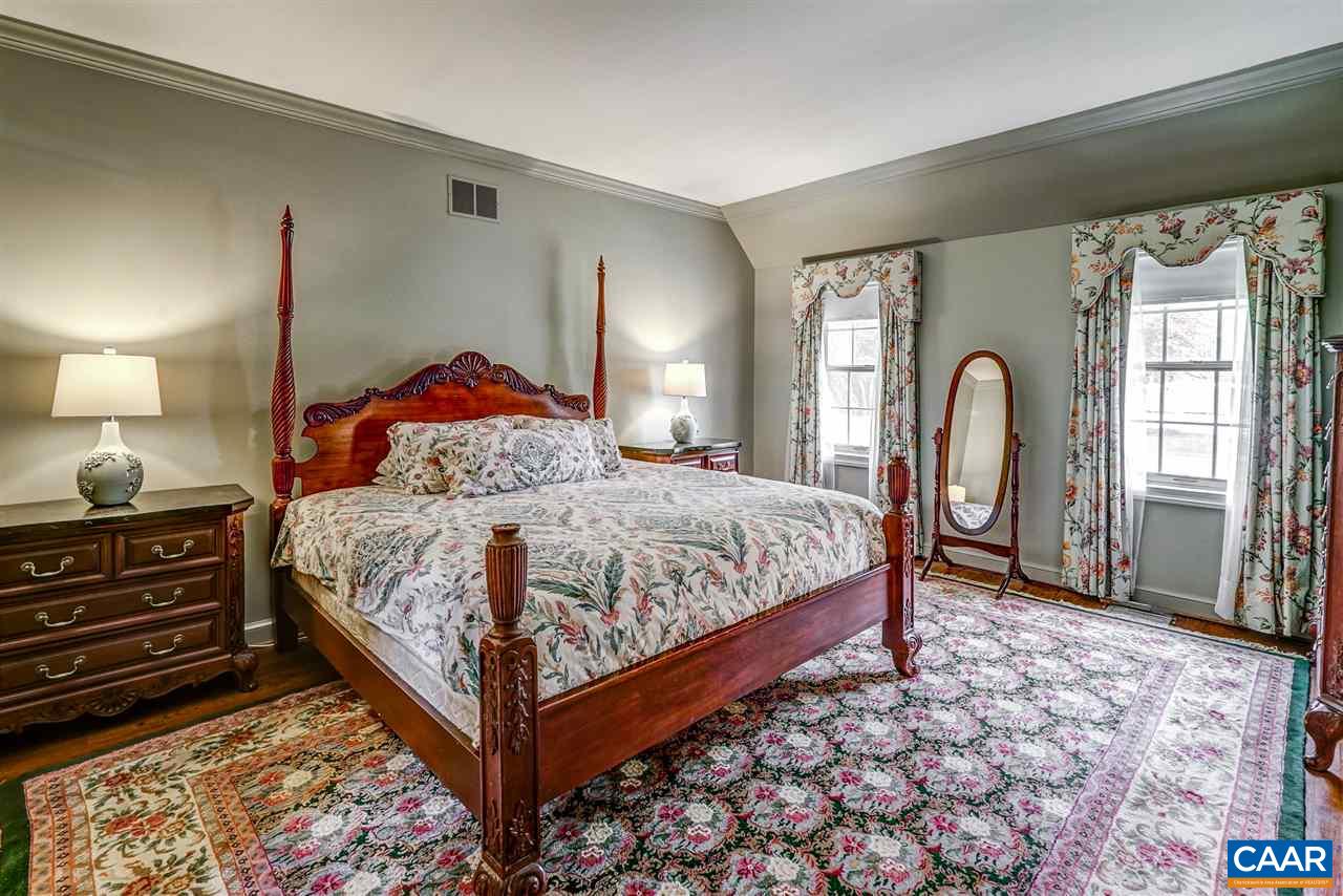 1730 Lambs Road Charlottesville, VA 22901 - Photo 36 of 50 a bedroom with a bed and a mirror