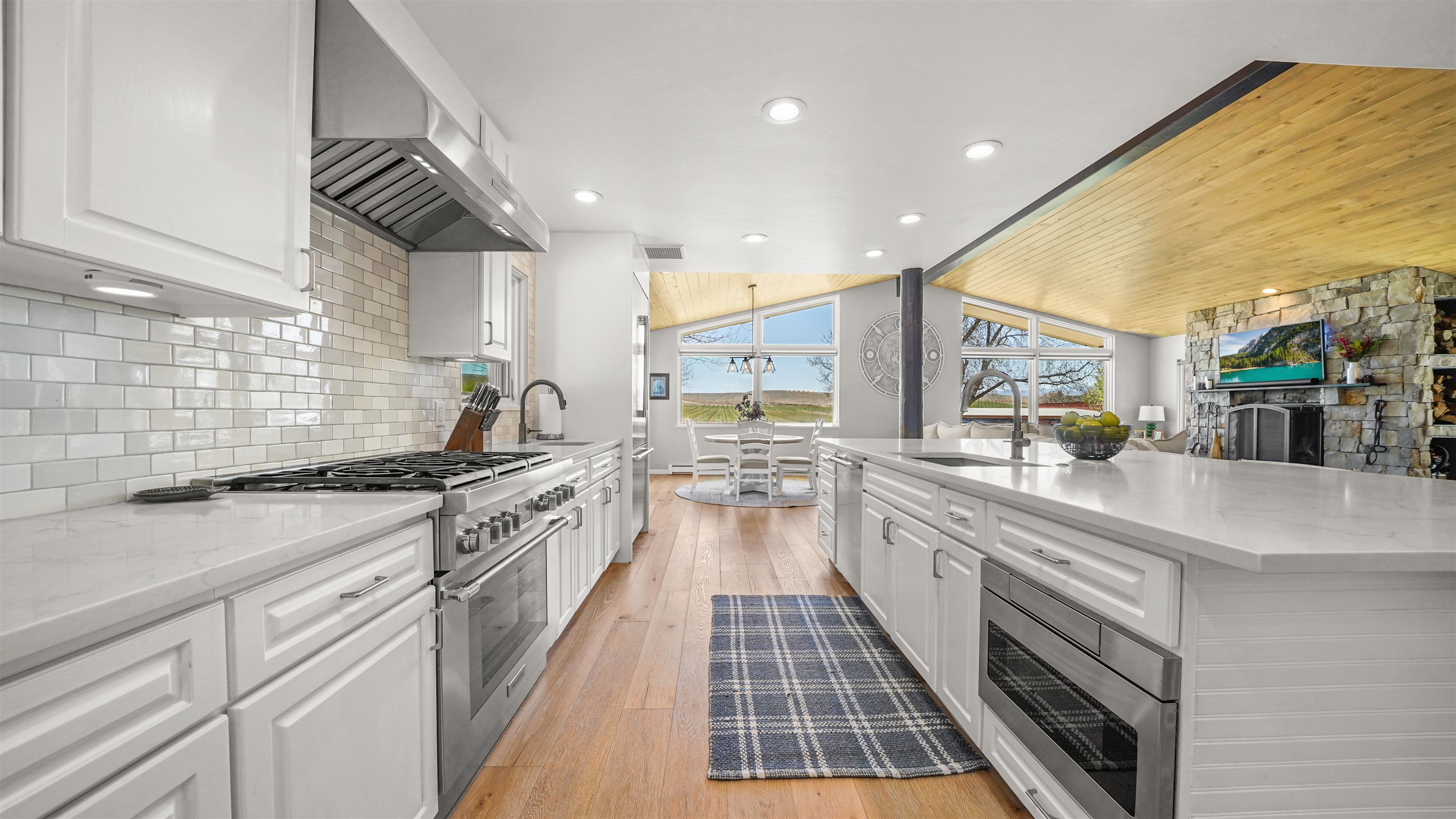 3339 C Road Palisade, CO 81526 - Photo 9 of 39 a large kitchen with stainless steel appliances granite countertop a lot of counter space and a sink