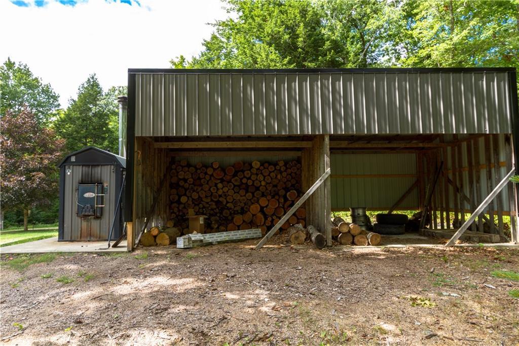 213 Sleepy Hollow Road Appleton, ME 04862 - Photo 28 of 29 Close up of wood furnace and wood...