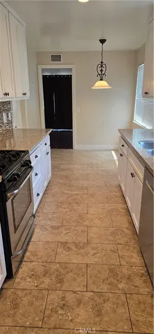 a view of an empty room with a stove
