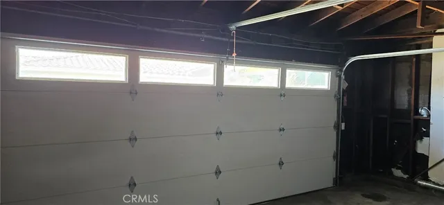 a bathroom with a window and a shower