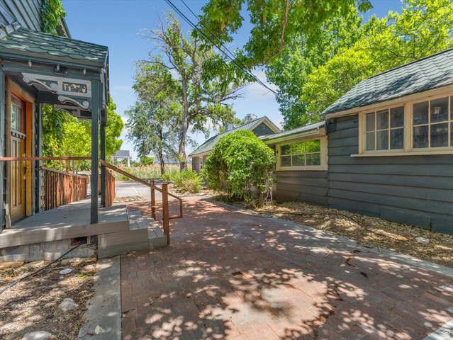 12825 South Fort Street Draper, UT 84020 - Photo 41 of 52 Outdoor brick patio featuring a covered porch entrance with decorative trim