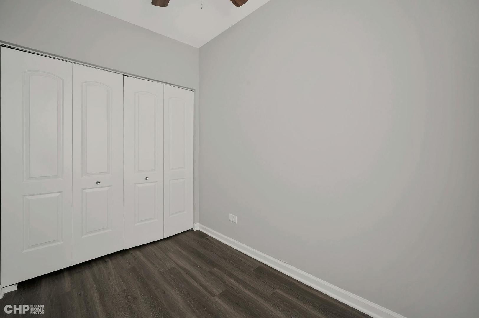 16 East 118th Place, Unit 1F Chicago, IL 60628 - Photo 9 of 10 a view of small space with wooden floor