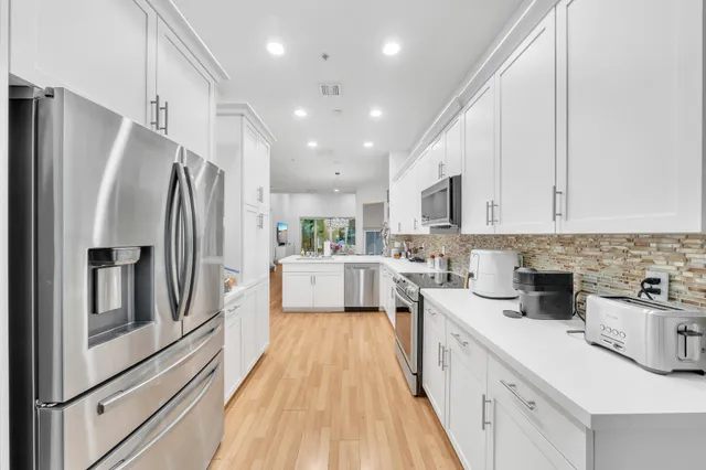 a bedroom with a bed and flat screen tv
