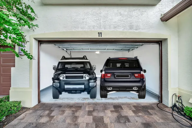 a kitchen with white cabinets sink and stainless steel appliances