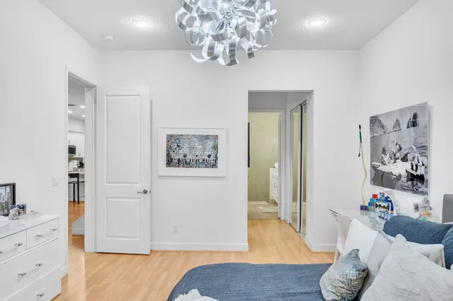 a bathroom with a double vanity sink a mirror and a shower