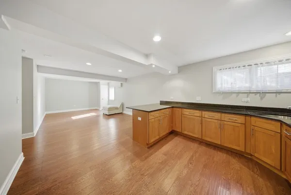 a view of a kitchen with a sink and a large window