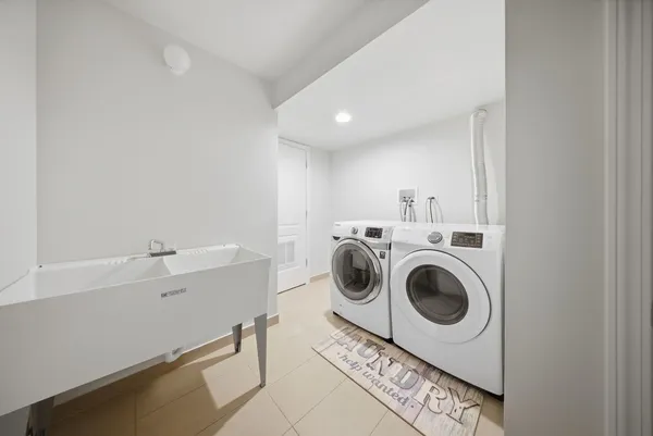 a utility room with dryer and washer