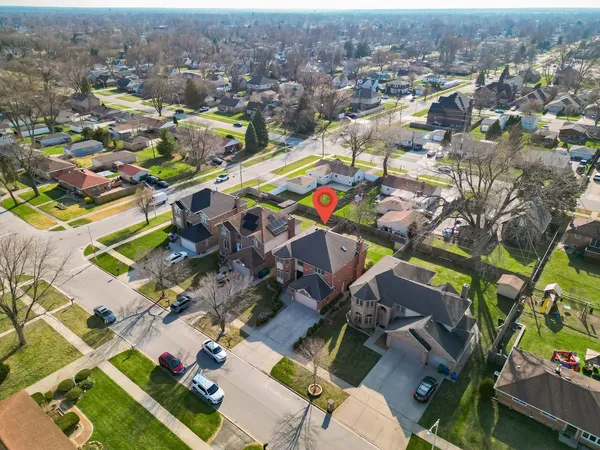 an aerial view of residential houses with outdoor space