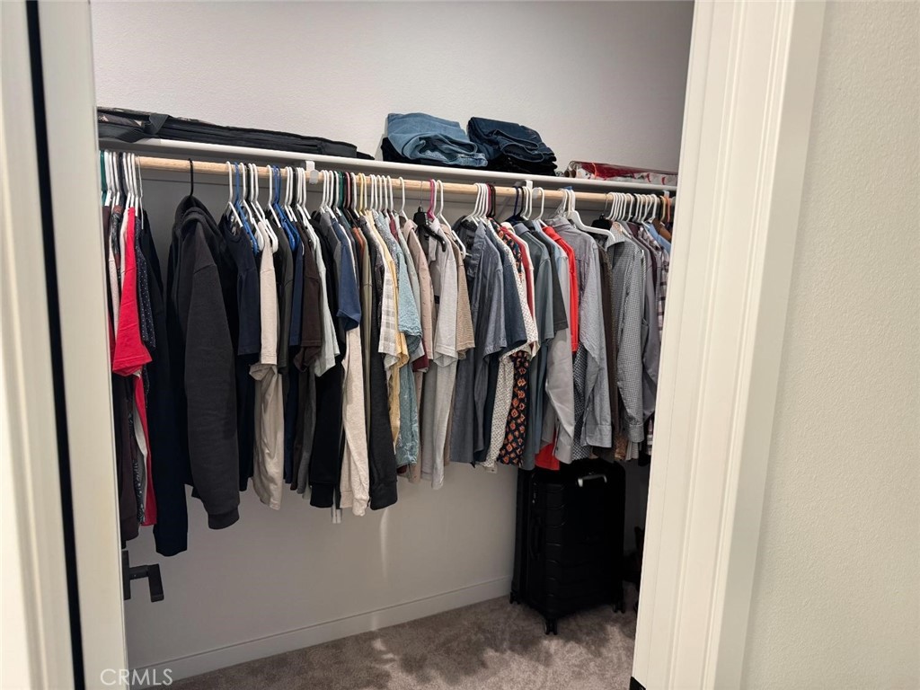 4035 Braden Road Madera, CA 93636 - Photo 17 of 29 a view of walk in closet with clothes