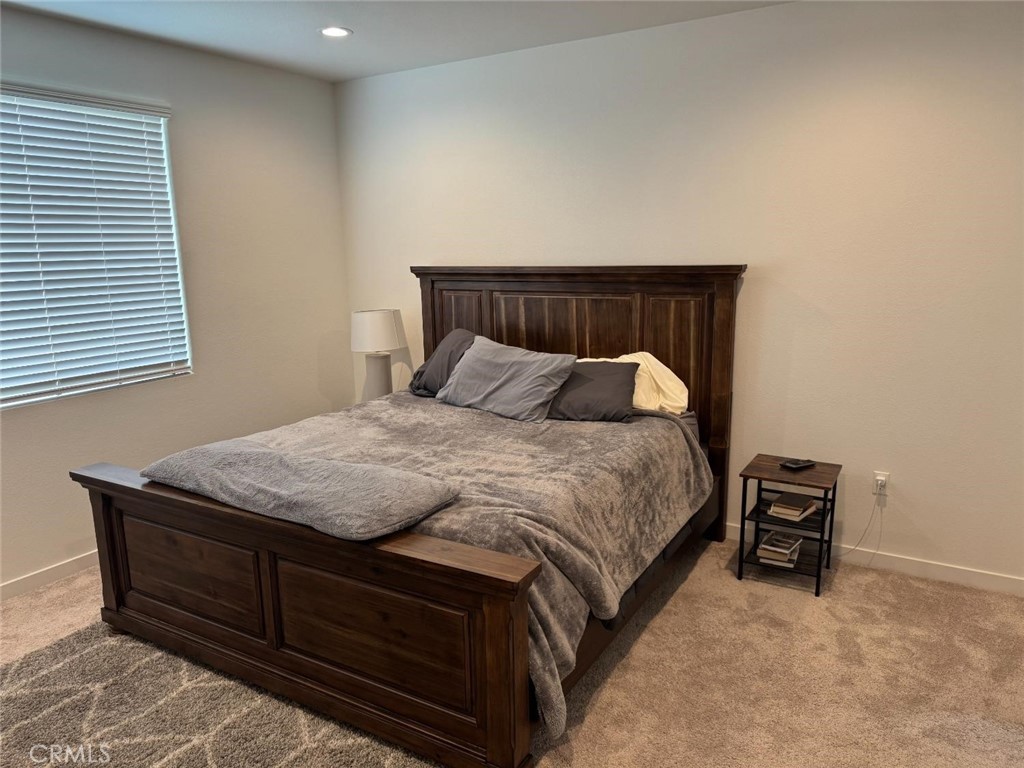 4035 Braden Road Madera, CA 93636 - Photo 18 of 29 a bedroom with a bed and a window