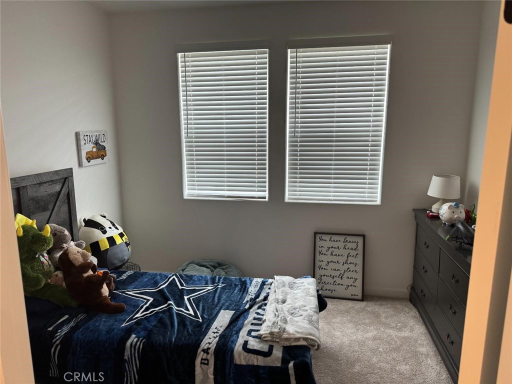 4035 Braden Road Madera, CA 93636 - Photo 20 of 29 a bedroom with a bed and a window