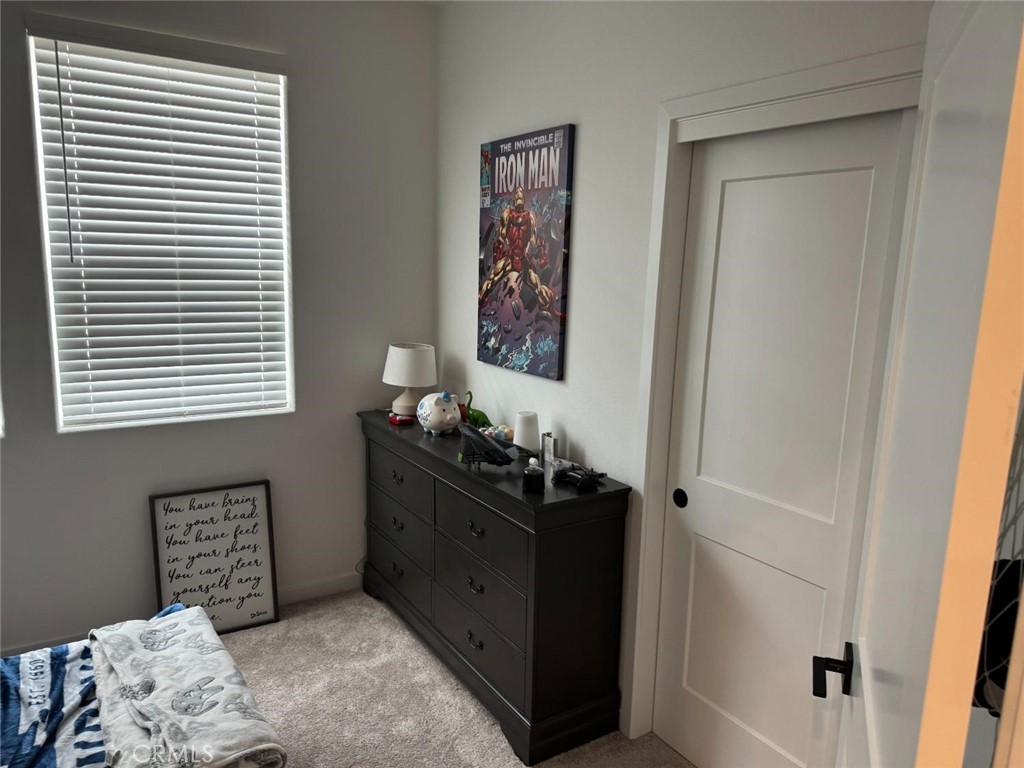 4035 Braden Road Madera, CA 93636 - Photo 21 of 29 a bedroom with a bed and a window