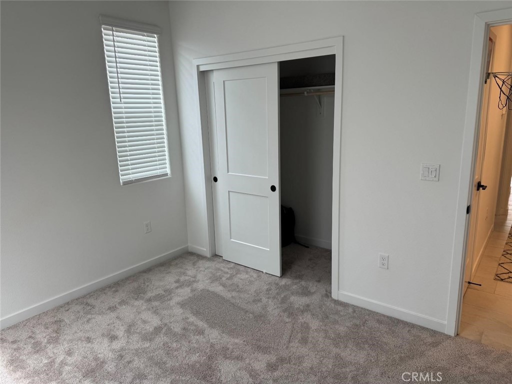 4035 Braden Road Madera, CA 93636 - Photo 24 of 29 an empty room with windows and closet