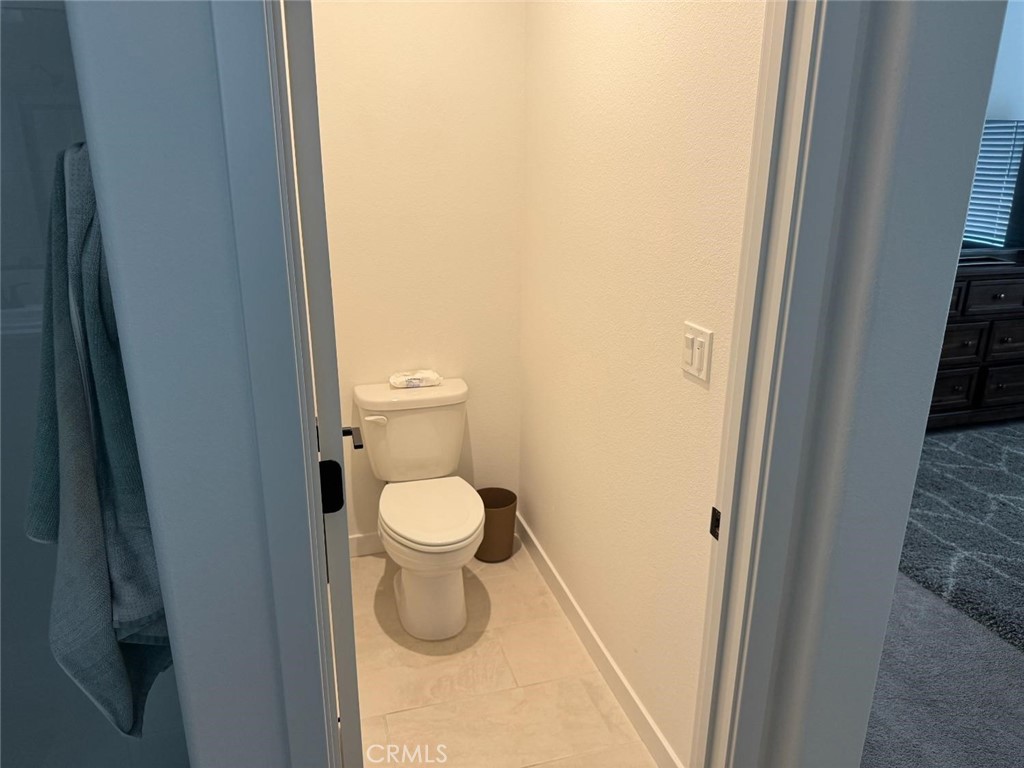 4035 Braden Road Madera, CA 93636 - Photo 28 of 29 a white toilet sitting next to a shower